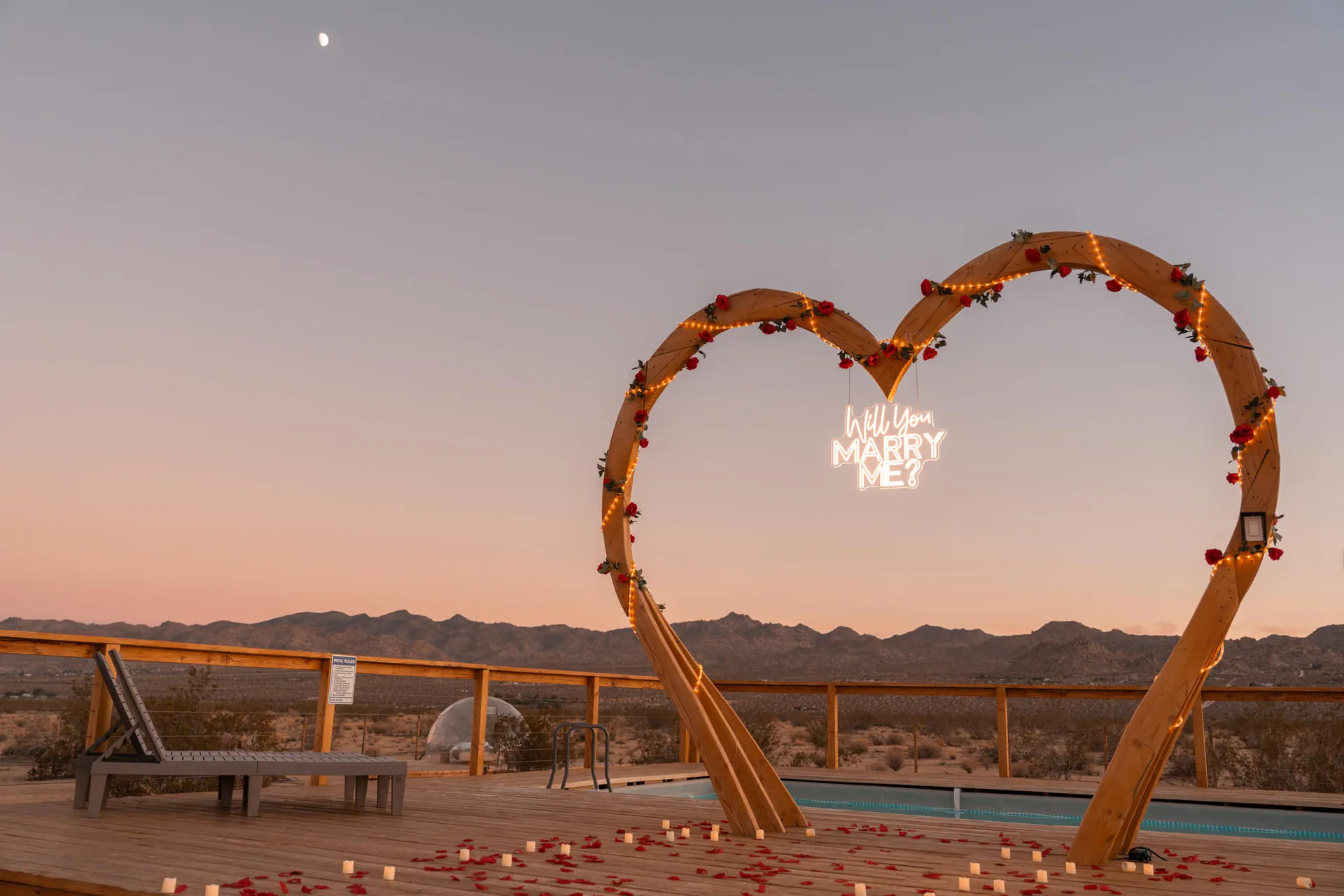 Heart arch with roses at sunset