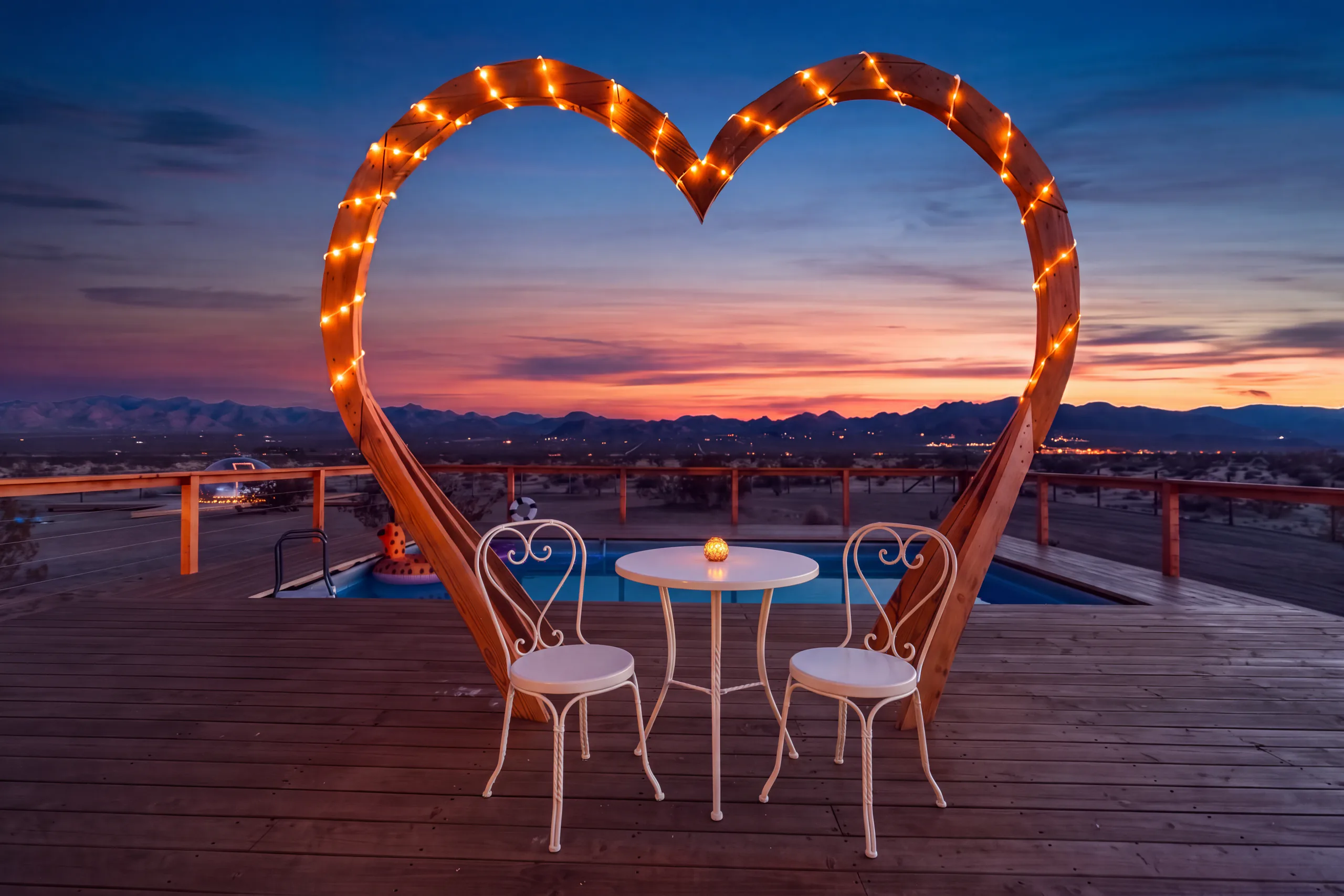Heart arch and bistro table at blue hour